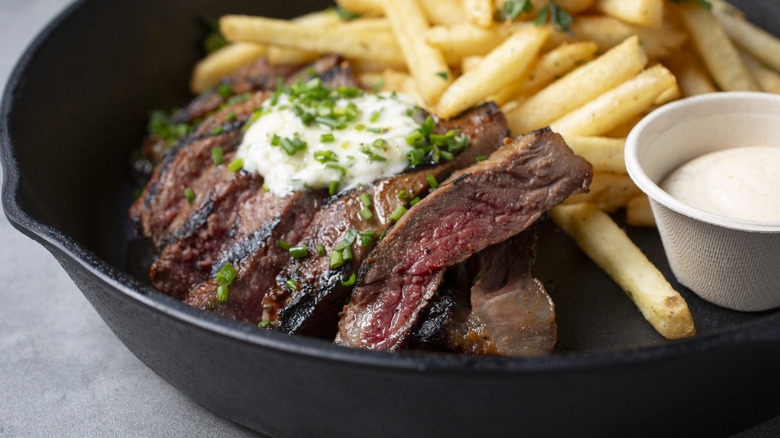 Sliced steak with melted butter