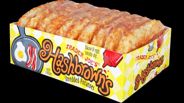 Packaged frozen hashbrowns against a black background