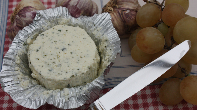 Boursin cheese with a knife