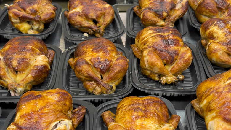 Grocery store rotisserie chickens in trays