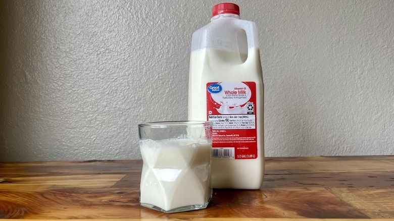 Glass and carton of Great Value By Walmart on a wooden table