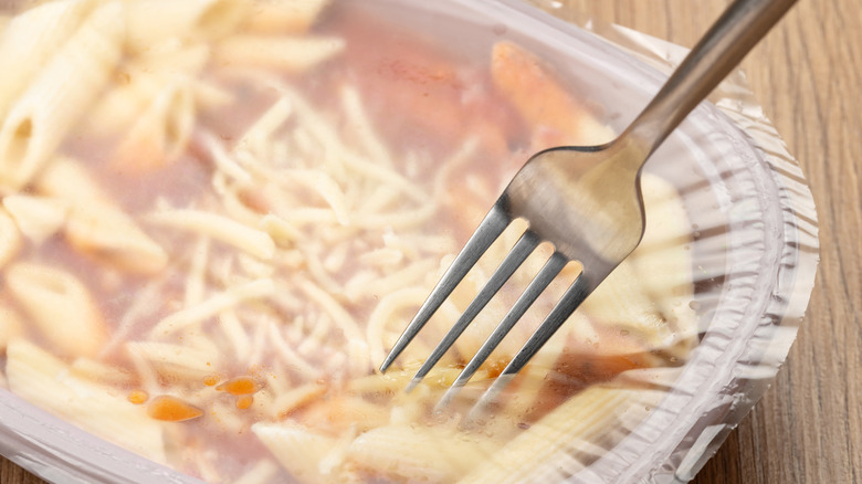 Frozen meal film being pierced with fork