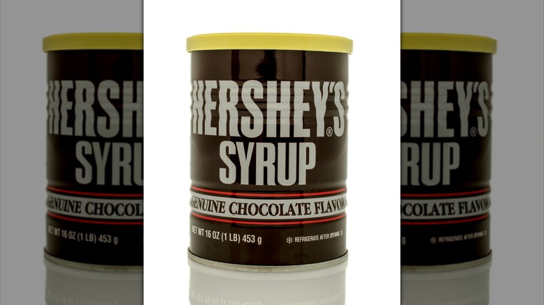 Can of Hershey's syrup with a yellow plastic lid