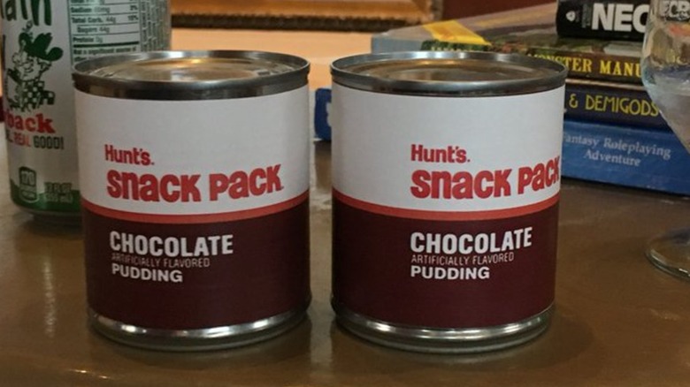 Two cans of Hunt's chocolate pudding