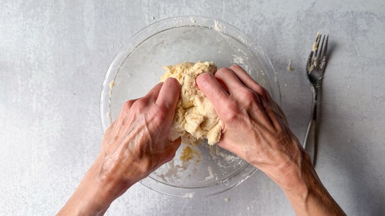 Mixing cardamom biscuit dough by hand