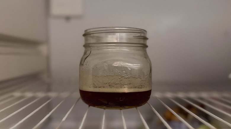 Brown butter in glass jar chilling in freezer