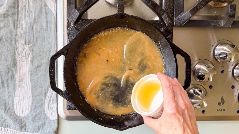 Reducing chicken stock for pan sauce in cast iron skillet
