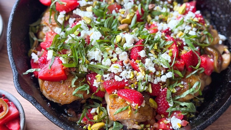 Close up of strawberry jalapeño chicken in cast iron skillet