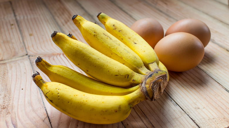 Banana bunch next to eggs