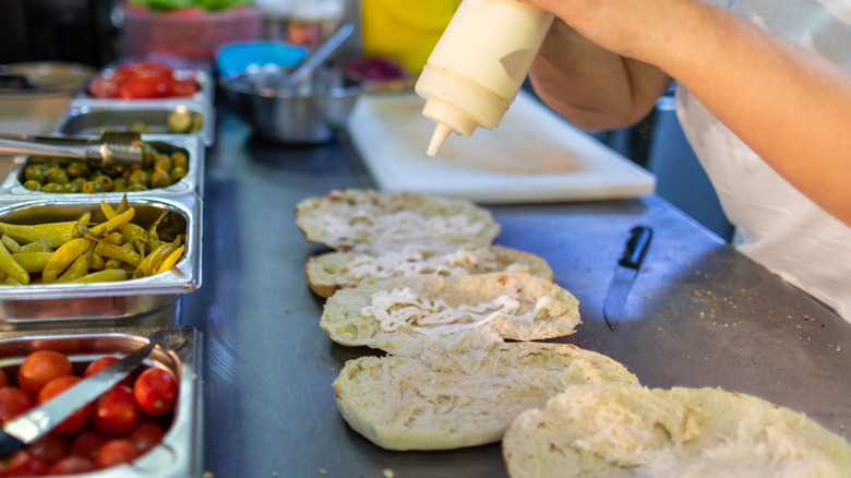 Sauce added to a sandwich before the fillings