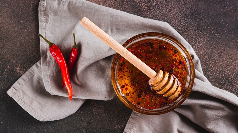 a bowl of hot honey over a kitchen towel