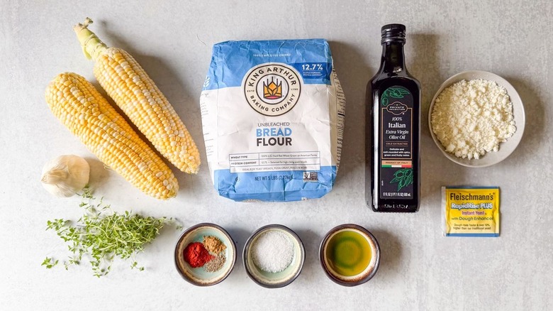 Summer corn and roasted garlic focaccia ingredients on countertop