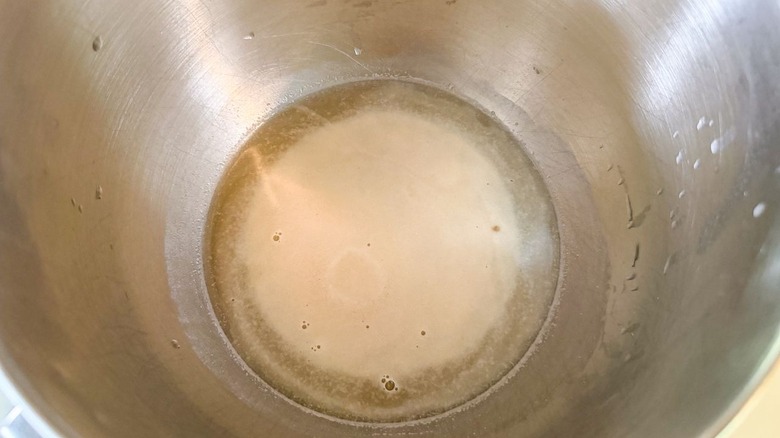 Yeast foaming over sweetened water in stand mixer bowl