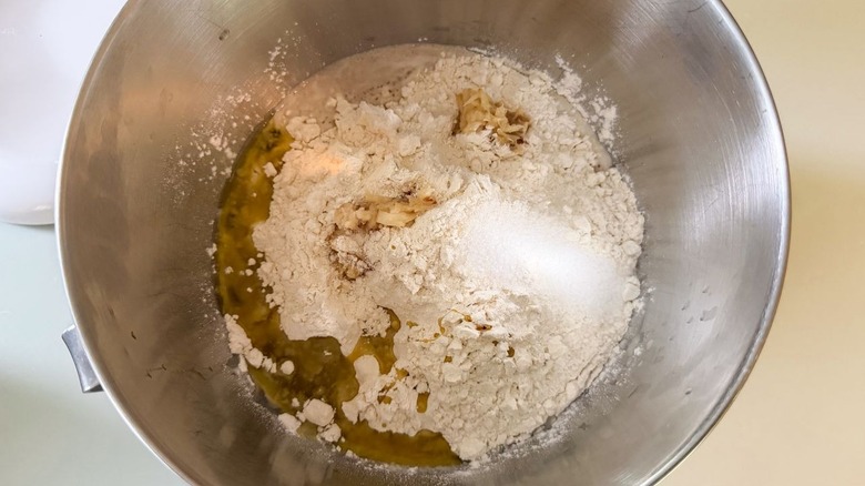 Focaccia dough ingredients in mixer bowl