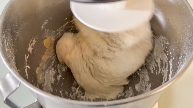 Kneading focaccia dough in stand mixer bowl with dough hook