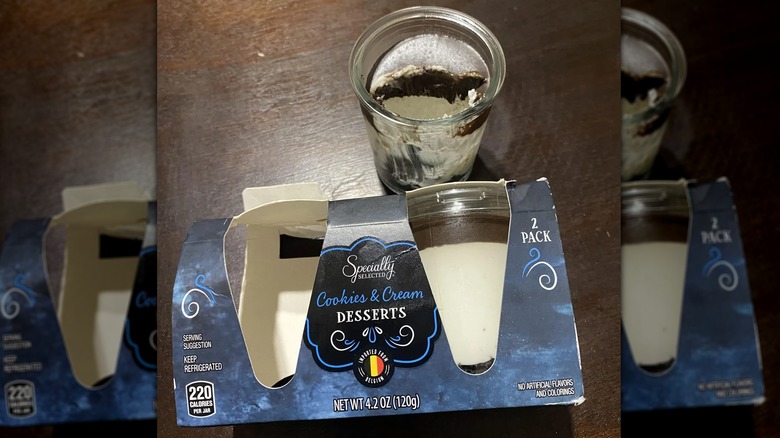 Package of cookies and cream dessert along with one that has been opened and partly eaten