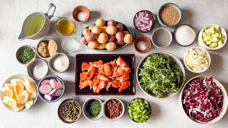 Summery hot-smoked salmon salad ingredients on countertop