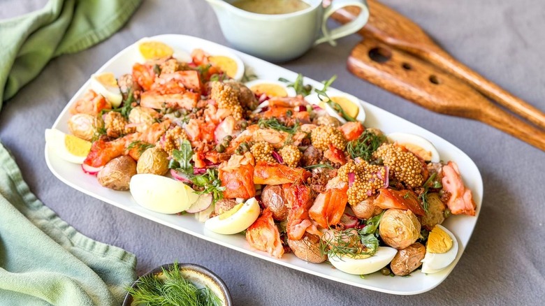 Summery hot-smoked salmon salad on serving platter