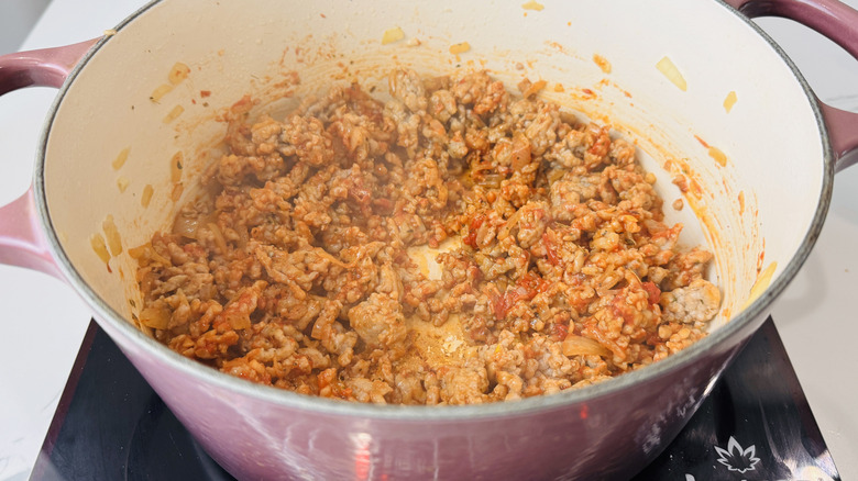 crumbled cooked sausage in a pot