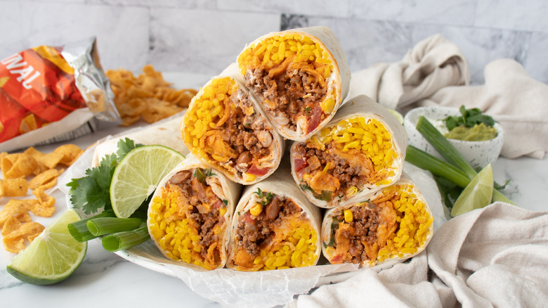 Plated and halved Frito pie burritos