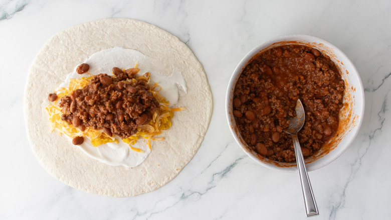 Large flour tortilla topped with chili