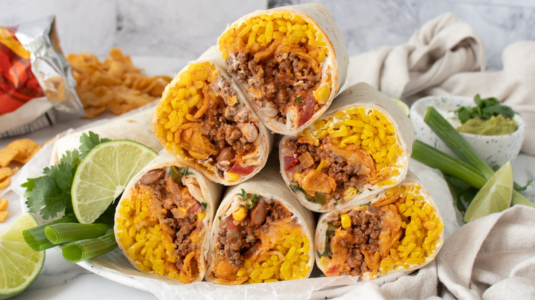 Final plate picture of several Frito pie burritos cut in half