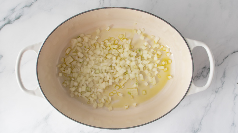 Onions sauteing in a Dutch oven