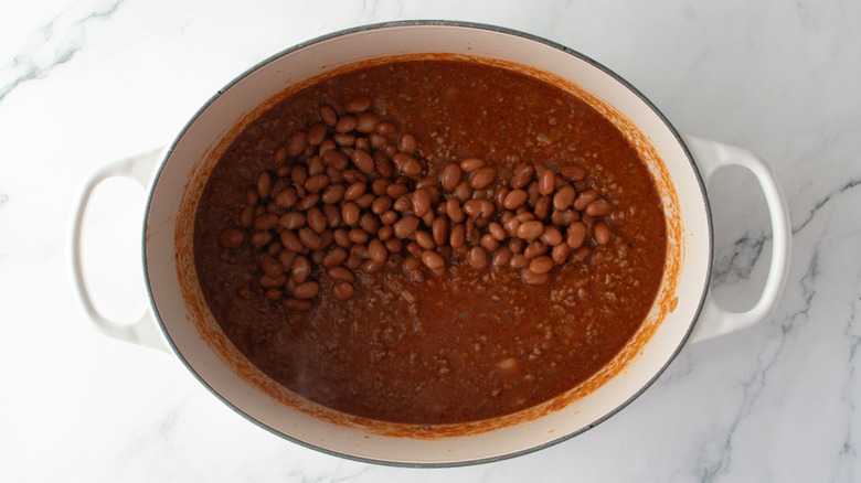 Chili con carne in a Dutch oven with pinto beans