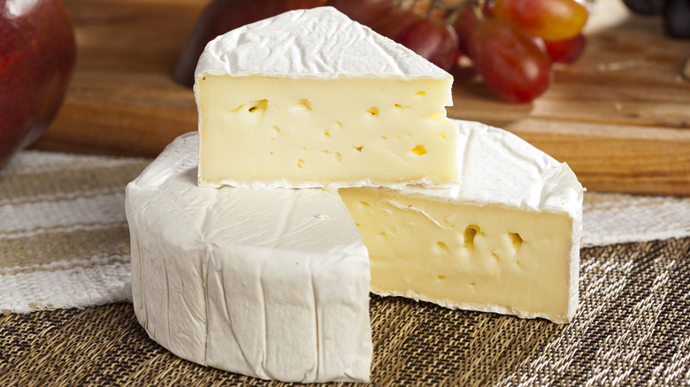 Wheel and slice of Brie cheese