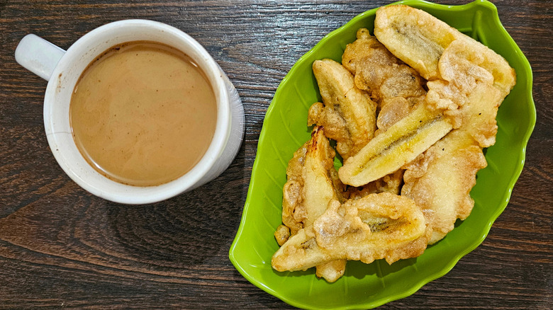 A cup of coffee and banana fries
