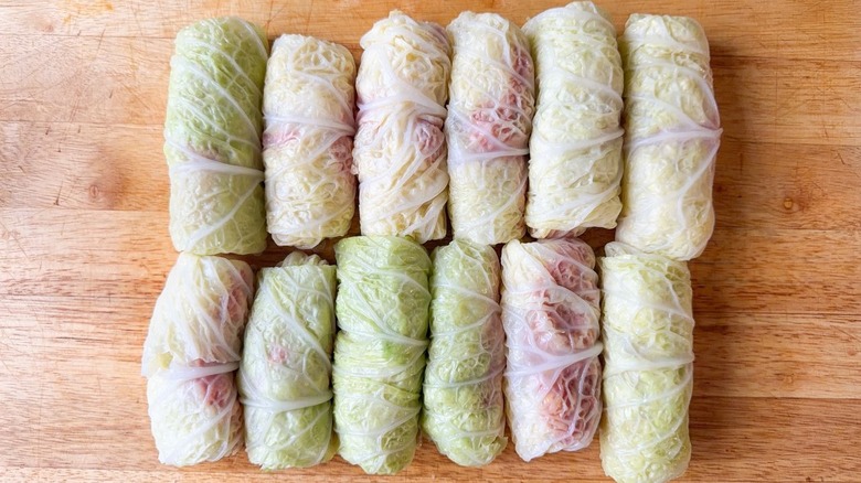 Raw Swedish-inspired stuffed cabbage rolls on cutting board