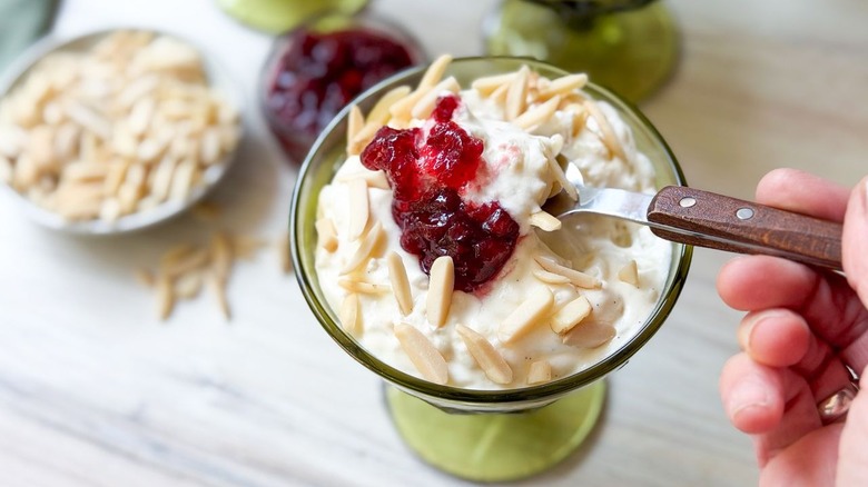 Serving glass with spoonful of Swedish-style rice pudding close up
