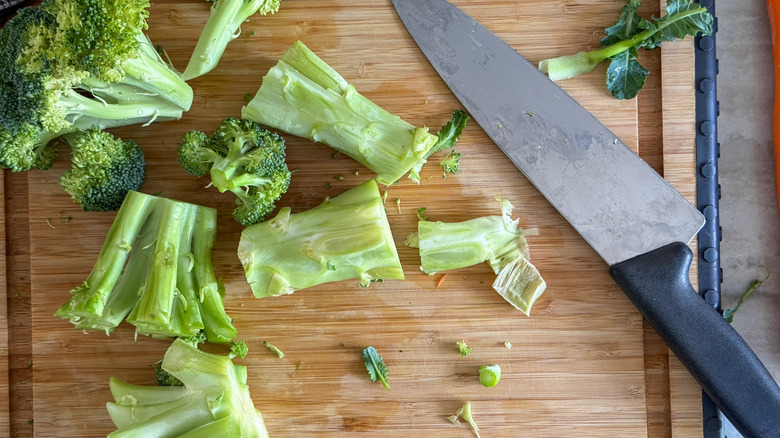 Broccoli stems and florets on board