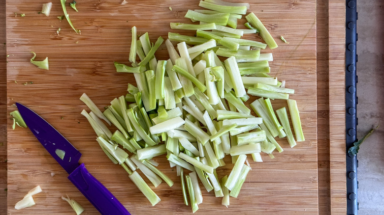 julienned broccoli stems on board