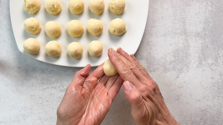 Rolling white chocolate meyer lemon ganache into balls