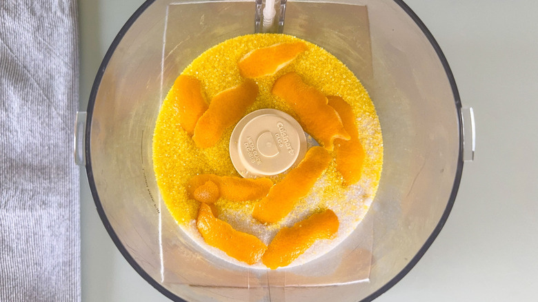 Meyer lemon zest, granulated sugar and yellow sanding sugar in food processor bowl