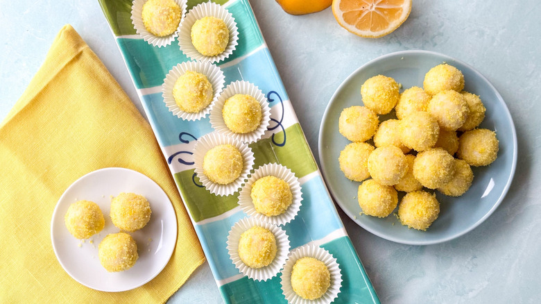 Sweet and simple lemon truffles on serving platter and plates