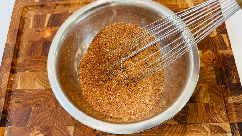 Whisk stirring dry rub in bowl