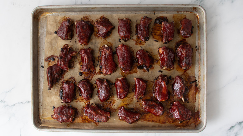 return to the oven and bake riblets