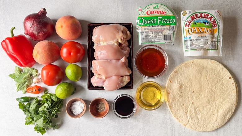Sweet and spicy peach chicken quesadilla ingredients on countertop