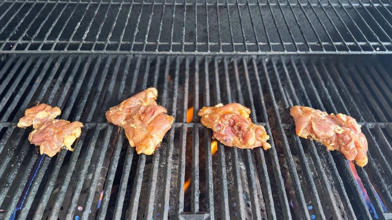 Chicken thighs on grill