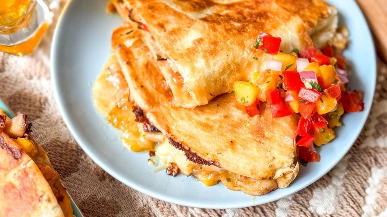 Close-up of sweet and spicy peach chicken quesadillas on plate