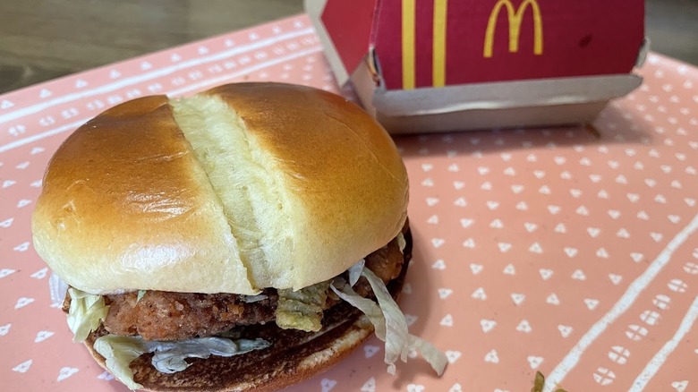 A Hot Honey McCrispy Sandwich next to the box it comes in.