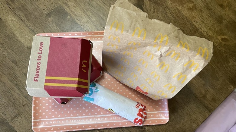 Hot Honey items from McDonald's in their packaging on a tray.