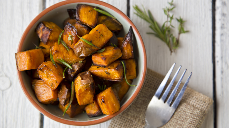 Oven roasted sweet potatoes with thyme and rosemary