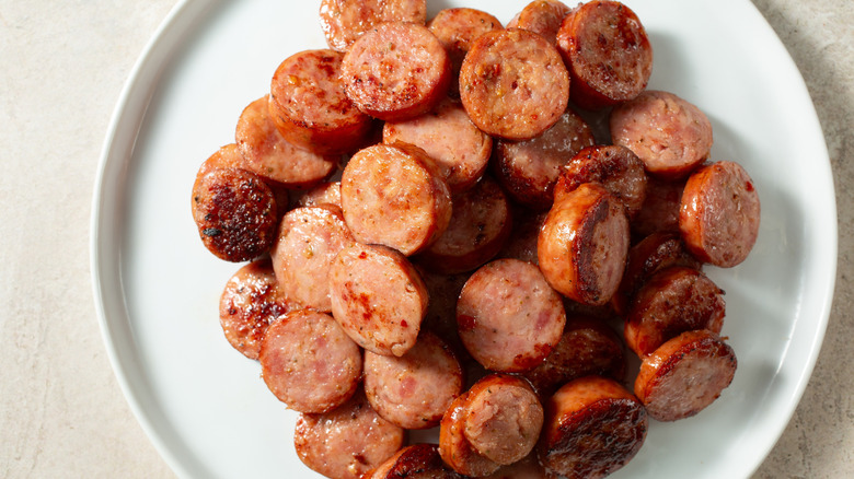 A plate of sliced andouille photographed from above.