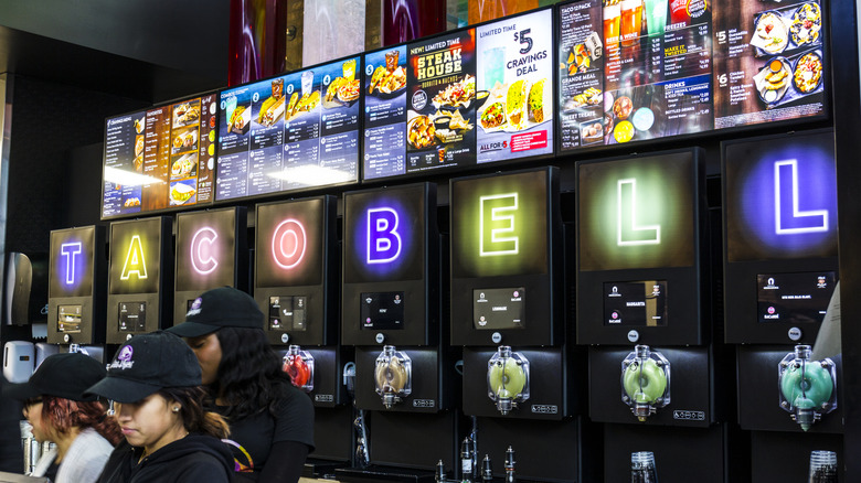 The counter of a Taco Bell Cantina with beer taps and Taco Bell Twisted Freeze machines visible
