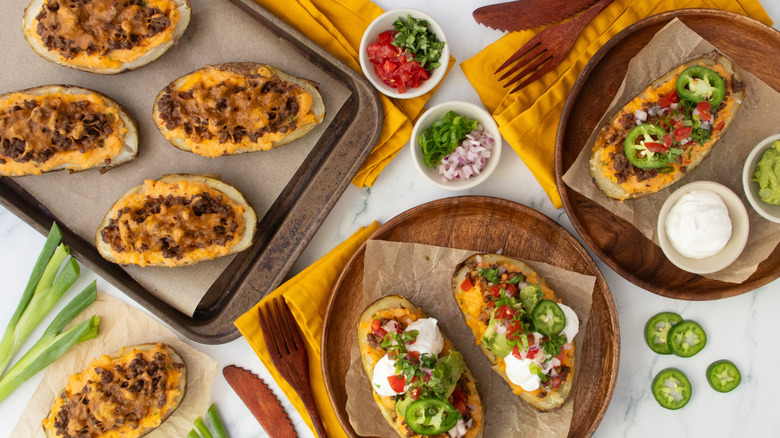 Overhead shot of several taco-themed twice baked potatoes