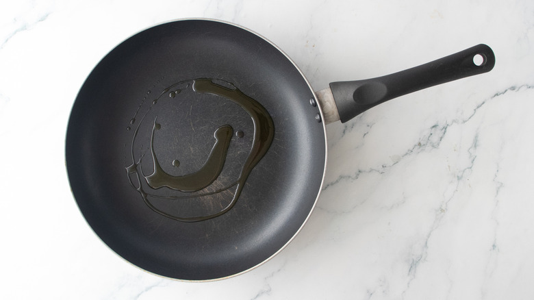 A large nonstick skillet drizzled with olive oil