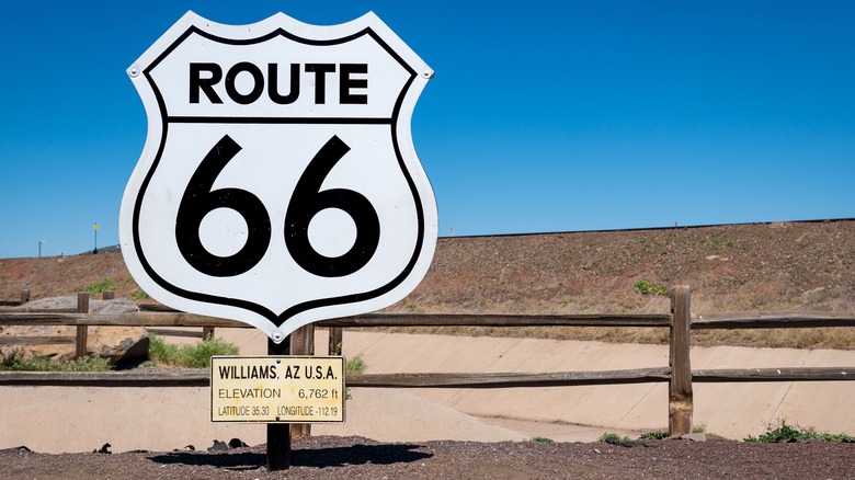A Route 66 sign alongside the road in Williams, Arizona